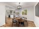Dining room area with modern light fixture and hardwood floors at 3193 W 134Th Cir, Broomfield, CO 80020