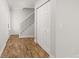 Hallway featuring hardwood floors and staircase at 3193 W 134Th Cir, Broomfield, CO 80020