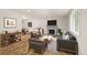 Inviting living room with fireplace, stylish furniture, and bright natural light at 3193 W 134Th Cir, Broomfield, CO 80020