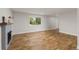 Bright living room featuring hardwood floors and large window at 3193 W 134Th Cir, Broomfield, CO 80020