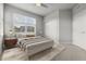 Cozy bedroom with a ceiling fan, large window, and closet at 5988 N Boston St, Denver, CO 80238