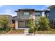 Modern two-story home with a well-manicured front yard and stylish architectural details at 5988 N Boston St, Denver, CO 80238