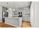 Bright kitchen with large center island, modern appliances, and ample cabinet space at 5988 N Boston St, Denver, CO 80238