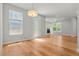 Bright and airy living area with hardwood floors and a modern fireplace at 5988 N Boston St, Denver, CO 80238