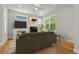 Cozy living room with fireplace, large windows, and hardwood floors at 5988 N Boston St, Denver, CO 80238