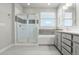 The main bathroom boasts a glass-enclosed shower and a soaking tub at 5988 N Boston St, Denver, CO 80238