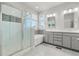 Spacious main bathroom with a glass-enclosed shower and double vanity at 5988 N Boston St, Denver, CO 80238