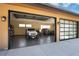 Spacious garage with modern epoxy flooring and space for multiple vehicles and storage at 17401 Snowcreek Ln, Morrison, CO 80465