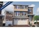 New construction two-story home featuring an attached garage and well-manicured front yard at 1152 Sugarloaf Ln, Erie, CO 80516