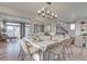 Modern eat-in kitchen features a large center island with seating, pendant lighting, and hardwood floors at 1152 Sugarloaf Ln, Erie, CO 80516