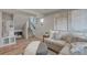 Inviting living room with a comfortable sofa, a dog nook, and stylish decor at 1152 Sugarloaf Ln, Erie, CO 80516