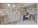 Bright home office with a desk, shelving, and a large world map at 1152 Sugarloaf Ln, Erie, CO 80516