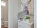 Stylish powder room with rustic artwork, modern vanity, and chic decorative accents at 1152 Sugarloaf Ln, Erie, CO 80516
