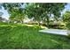 Expansive, well-maintained lawn with mature trees, creating a peaceful and inviting outdoor space at 5193 S Flanders Ln, Centennial, CO 80015