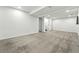 Spacious basement with neutral carpet, recessed lighting, and doorway to additional rooms at 5193 S Flanders Ln, Centennial, CO 80015