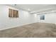 Large basement has neutral carpet, recessed lights and egress window at 5193 S Flanders Ln, Centennial, CO 80015