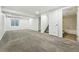 Spacious basement features neutral carpet, egress window, and access to an additional bathroom at 5193 S Flanders Ln, Centennial, CO 80015