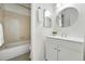 Cozy bathroom with a shower-tub combination and a bright vanity area at 5193 S Flanders Ln, Centennial, CO 80015