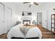 Spacious bedroom with dual closets, modern ceiling fan, and neutral decor at 5193 S Flanders Ln, Centennial, CO 80015
