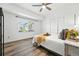 Bright bedroom with a vaulted ceiling, new floors and a large window at 5193 S Flanders Ln, Centennial, CO 80015
