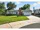 Inviting home with well-kept lawn, a two-car garage, complemented by mature trees and established landscaping at 5193 S Flanders Ln, Centennial, CO 80015