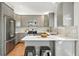 Bright kitchen featuring gray cabinets, stainless steel appliances, and stylish backsplash at 5193 S Flanders Ln, Centennial, CO 80015