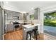 Updated kitchen with stainless steel appliances, gray cabinets, and a view of the backyard at 5193 S Flanders Ln, Centennial, CO 80015