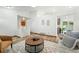 Open-concept living area showcasing a neutral color palette, and views into the kitchen at 5193 S Flanders Ln, Centennial, CO 80015