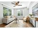 Inviting living room filled with natural light, neutral decor, and hardwood floors at 5193 S Flanders Ln, Centennial, CO 80015