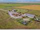 Aerial view of the property featuring multiple outbuildings on sprawling land at 47855 E 88Th Ave, Bennett, CO 80102
