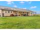 Expansive backyard featuring a covered porch and plenty of open green space at 47855 E 88Th Ave, Bennett, CO 80102