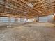 Barn interior featuring an open floorplan and exposed wooden support beams, perfect for storage at 47855 E 88Th Ave, Bennett, CO 80102