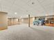 Expansive basement offering versatile space, carpet, laminate flooring, and potential for customization at 47855 E 88Th Ave, Bennett, CO 80102