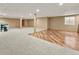 Spacious basement with carpet, laminate flooring, and neutral walls, perfect for entertaining at 47855 E 88Th Ave, Bennett, CO 80102