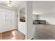 Bright foyer with decorative glass door, archway, and views of the living room at 47855 E 88Th Ave, Bennett, CO 80102