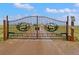 View of the property's ornate black metal front gate with wildlife themed design at 47855 E 88Th Ave, Bennett, CO 80102
