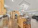 Bright kitchen featuring a bar, stainless steel appliances, and ample storage space at 47855 E 88Th Ave, Bennett, CO 80102