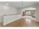 Upstairs living room with tile floor and stairs to the next level at 47855 E 88Th Ave, Bennett, CO 80102