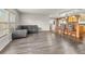 Spacious living room features stylish hardwood flooring and plenty of natural light at 47855 E 88Th Ave, Bennett, CO 80102