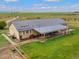 Aerial view of rear exterior, featuring a patio and manicured lawn at 47855 E 88Th Ave, Bennett, CO 80102