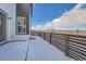 Snowy backyard with a wooden fence and view of the neighborhood at 960 Superior Dr, Superior, CO 80027