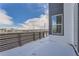 Snowy backyard with wood fence and partial home view at 960 Superior Dr, Superior, CO 80027