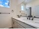 Double vanity bathroom with quartz countertops and black fixtures at 960 Superior Dr, Superior, CO 80027