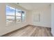 Light and airy bedroom with wood-look flooring and large windows at 960 Superior Dr, Superior, CO 80027