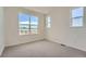 Bright bedroom with neutral carpeting and large windows at 960 Superior Dr, Superior, CO 80027