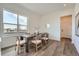 Modern dining room with a wood table and six chairs, offering natural light and a view at 960 Superior Dr, Superior, CO 80027