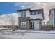Modern two-story home with stone and white exterior, showcasing a clean and contemporary design at 960 Superior Dr, Superior, CO 80027