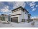 Side view of a two-story modern home with attached garage and fenced backyard at 960 Superior Dr, Superior, CO 80027