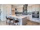 Modern kitchen with island, stainless steel appliances, and stylish cabinetry at 960 Superior Dr, Superior, CO 80027