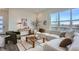 Open living space with sectional sofa, large windows, and a view to the kitchen at 960 Superior Dr, Superior, CO 80027